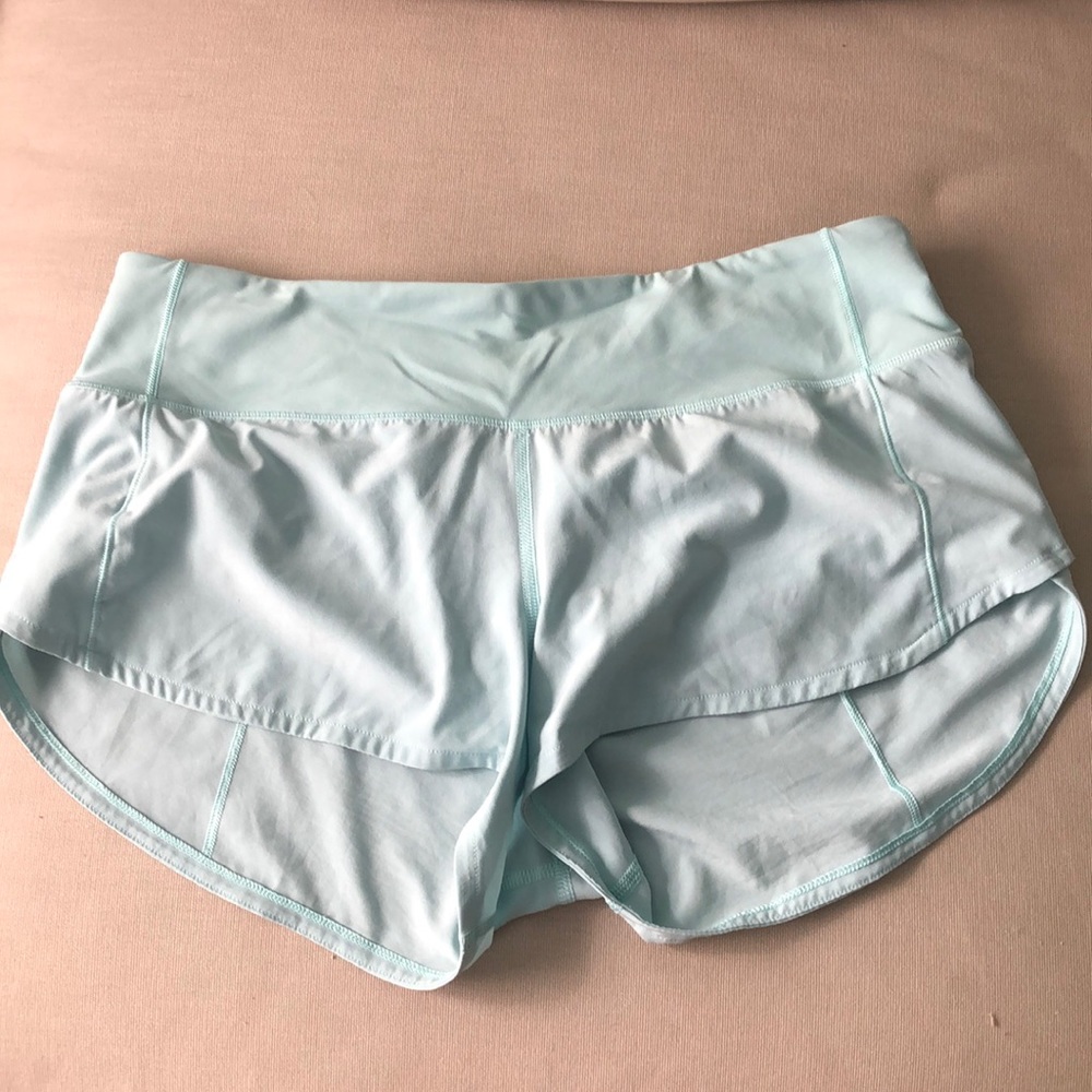 Sea foam green lululemon shorts.